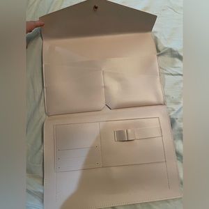 Brand new. Glass ladder & co. Travel clutch that will fit iPad and small laptop.